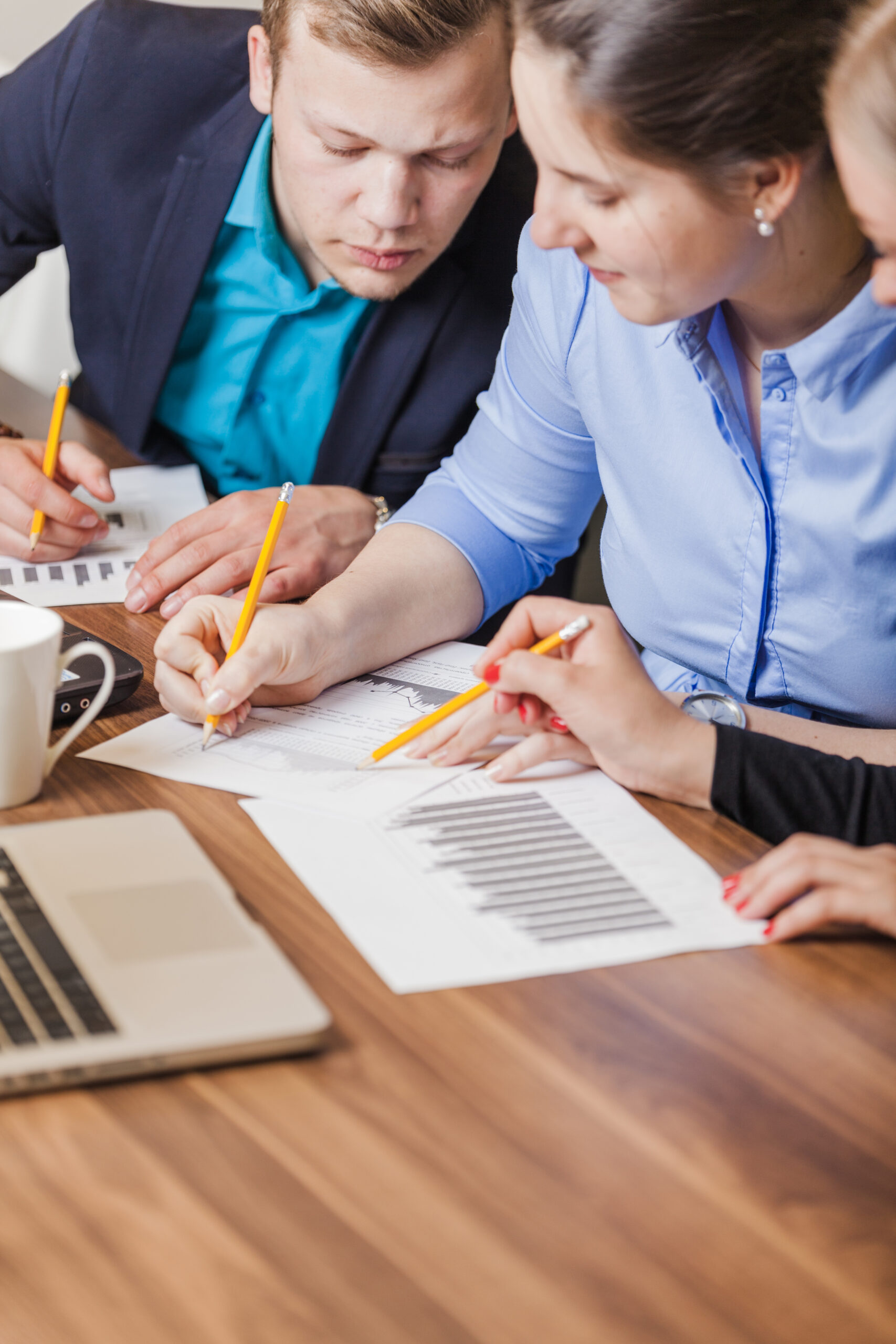 office-workers-sitting-desk-writing